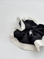 Elegance – Black Silk-Style Scrunchie with Pleated White Trim