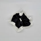 Elegance – Black Silk-Style Scrunchie with Pleated White Trim